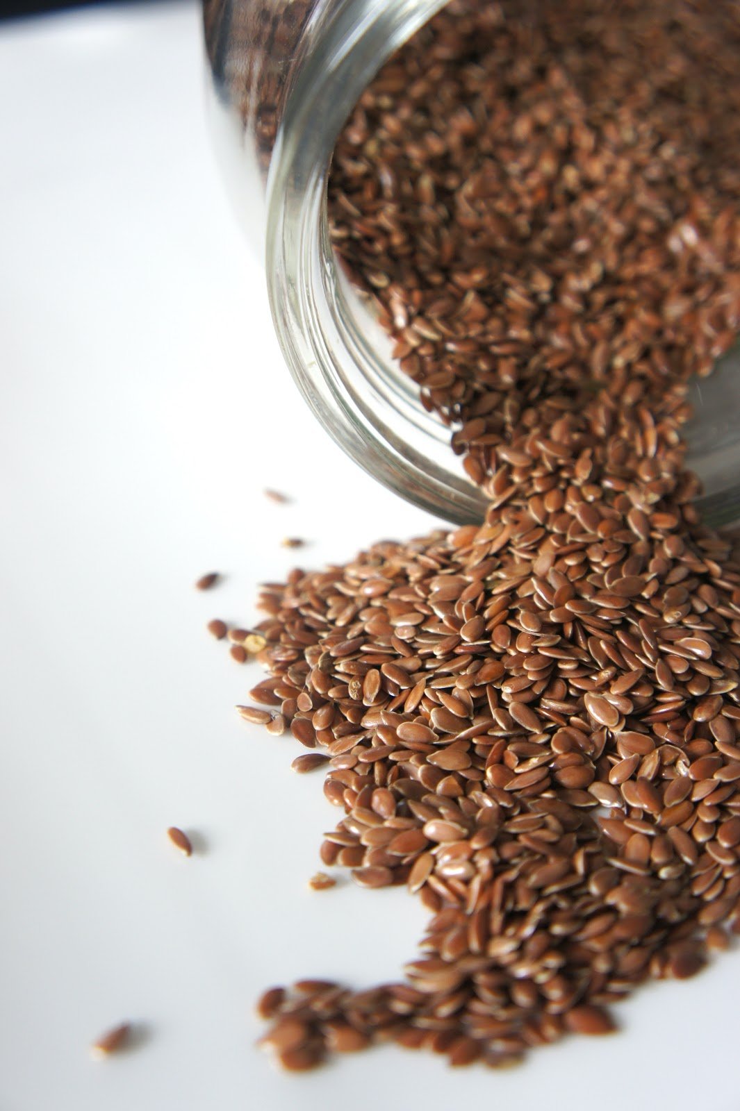 flax seeds spilling from jar